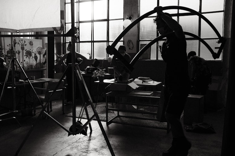 a group of people in a professional studio working