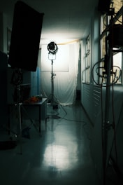 a room with a lamp and a window