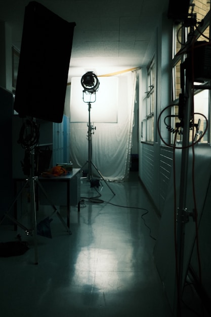 a room with a lamp and a window