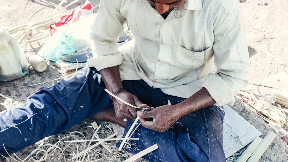 a man sitting on the ground