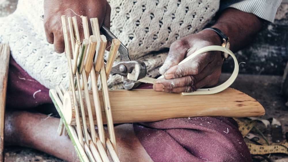 a person cutting wood