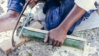 a person holding a pipe