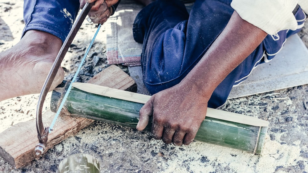 a person holding a pipe