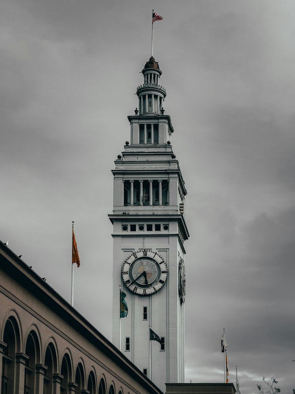 a clock tower with a flag on top