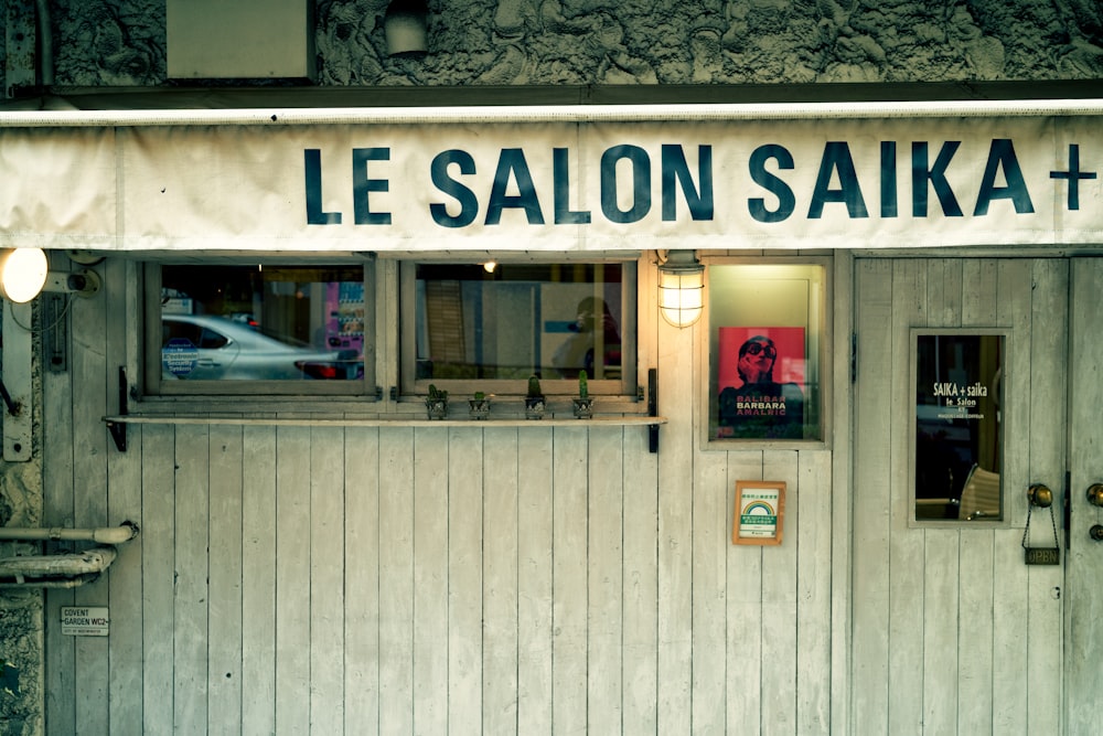 a building with windows and a sign on the front