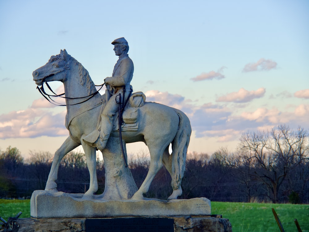 a statue of a person riding a horse