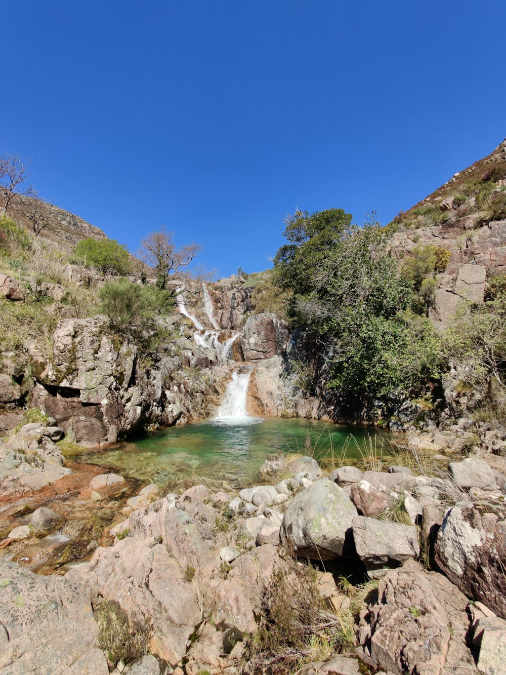 a waterfall in a rocky area