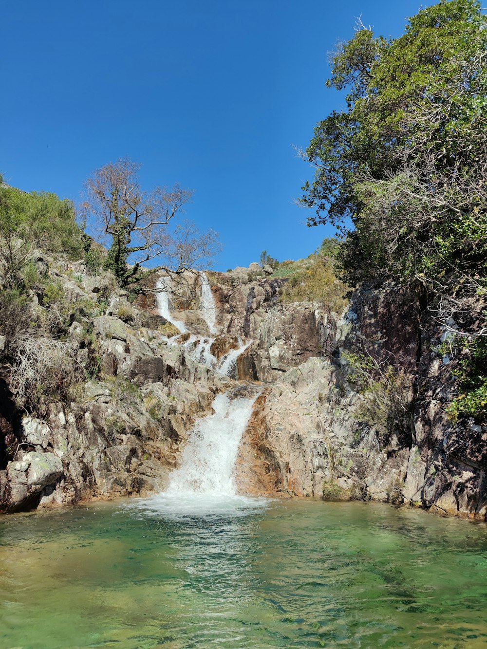 a waterfall over a cliff