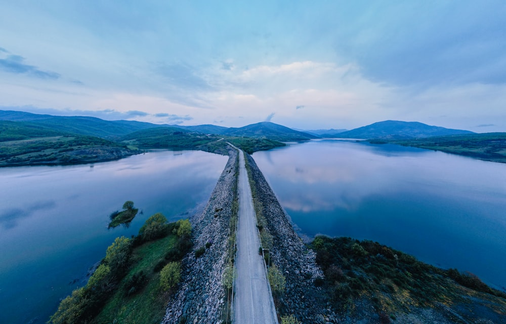 a body of water with a mountain in the background