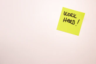 a yellow note with black text