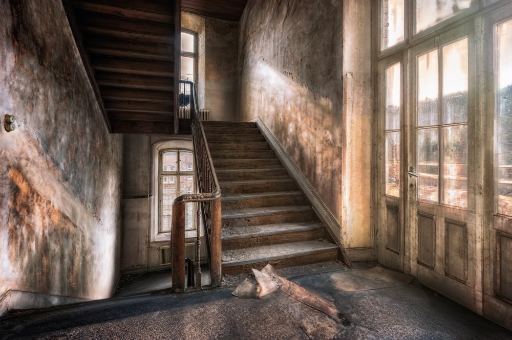 a room with a fireplace and a large window