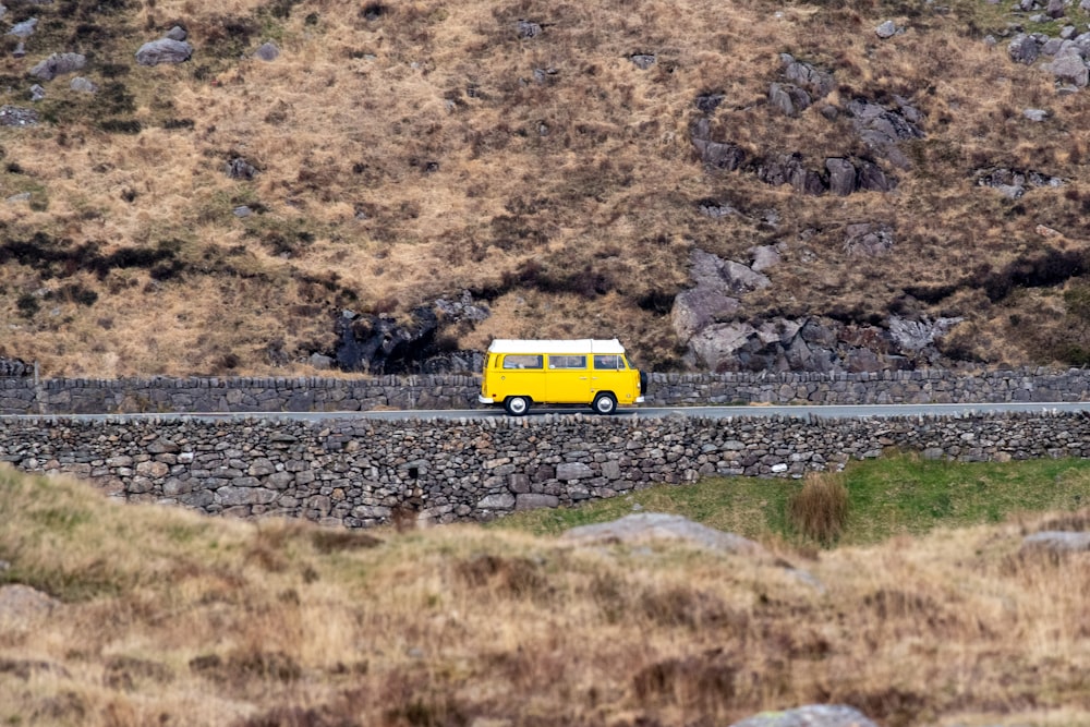 a yellow truck on a road