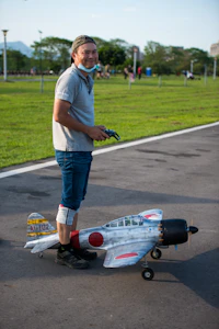 a man standing next to a race car on a track