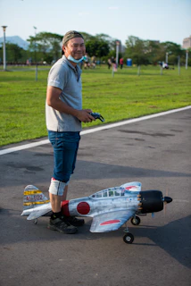 a man standing next to a race car on a track