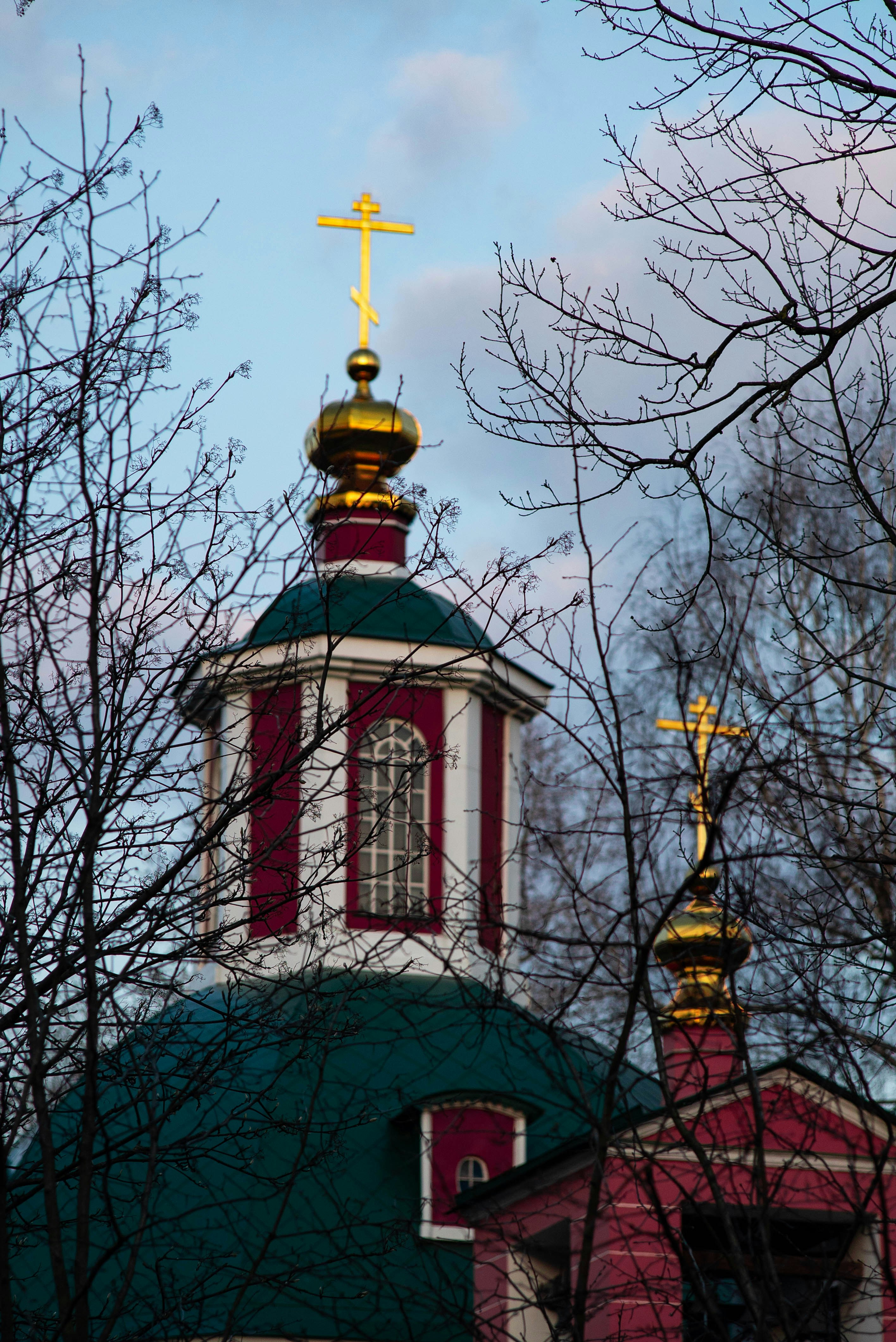 a building with a gold cross on top