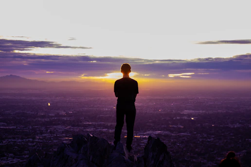 a person standing on a mountain