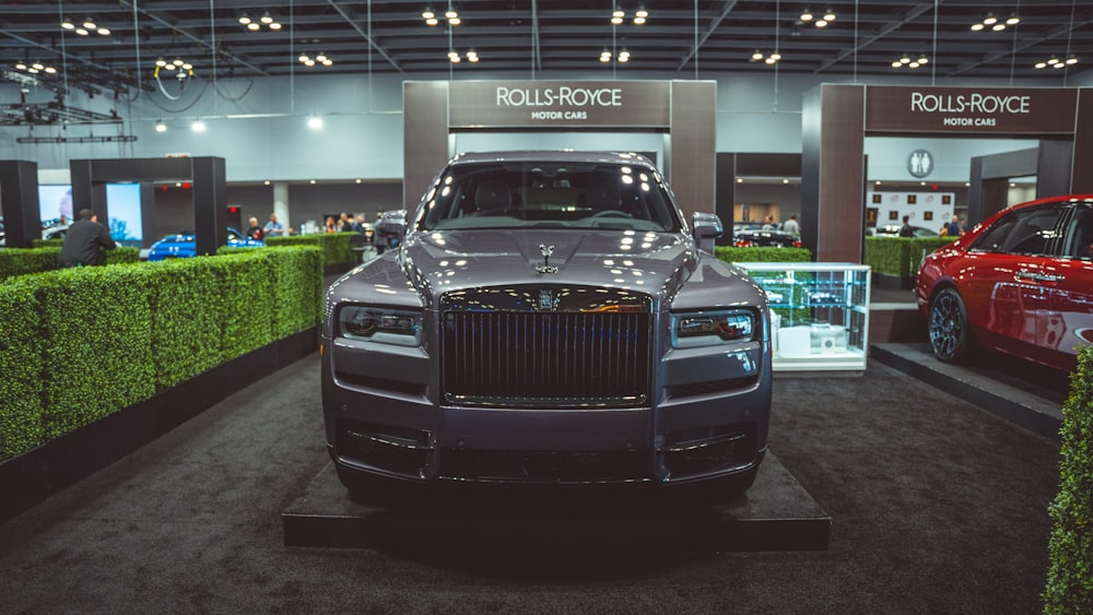 a black truck parked in a showroom