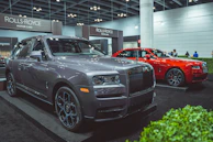 Rolls-Royce elegantly showcased under soft showroom lights.