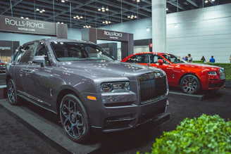 Rolls-Royce elegantly showcased under soft showroom lights.