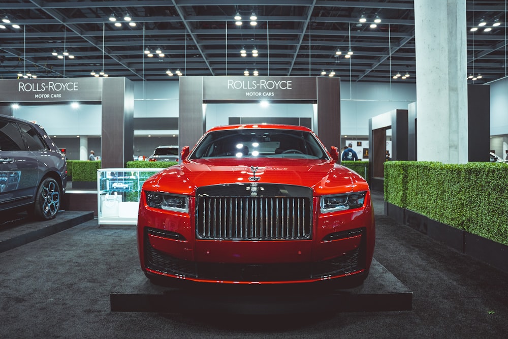 a red car parked in a showroom
