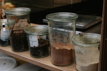 a group of jars with food in them