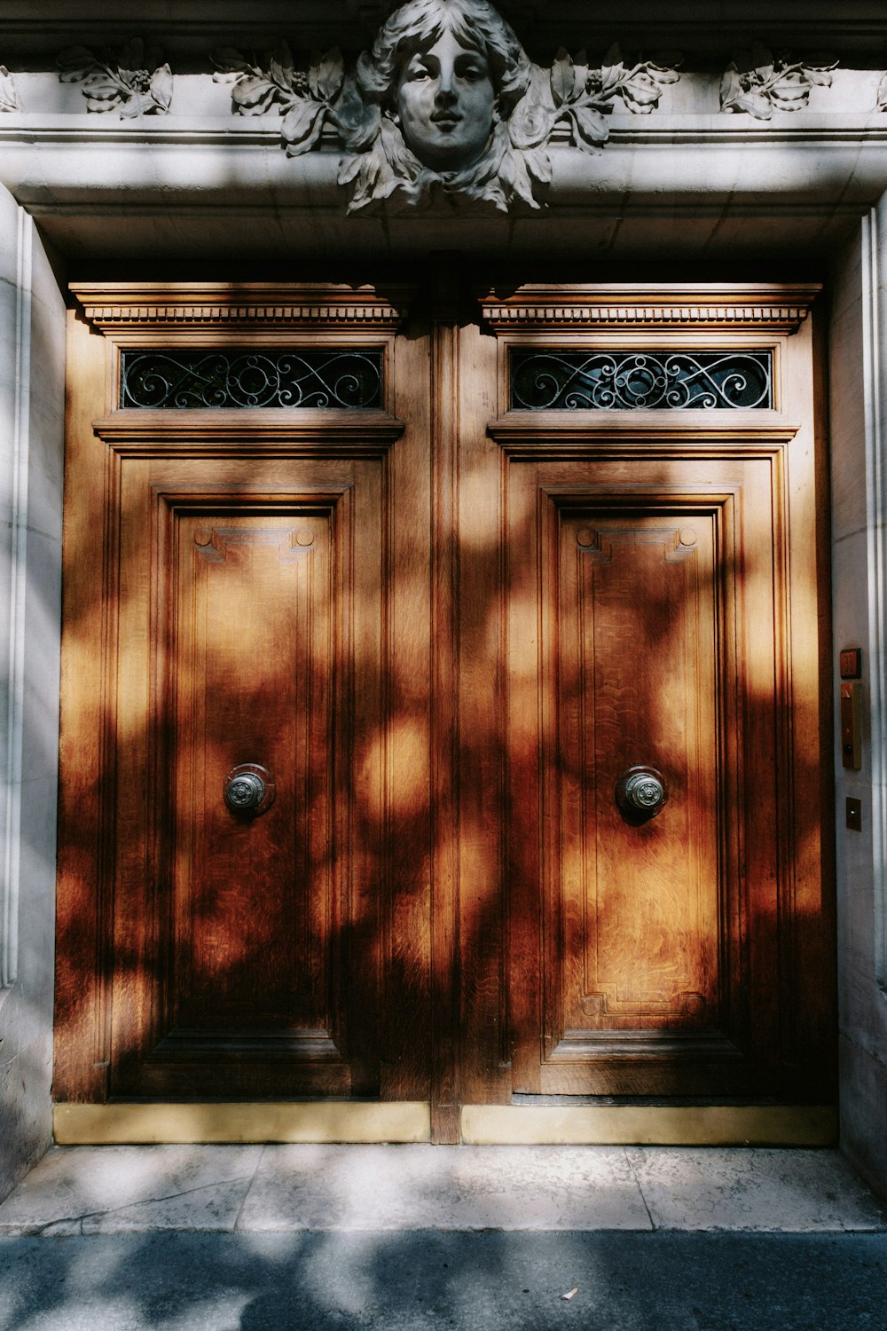 a wood door with a painting on the wall