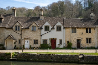 a building with a pond in front of it