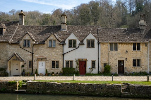 a building with a pond in front of it