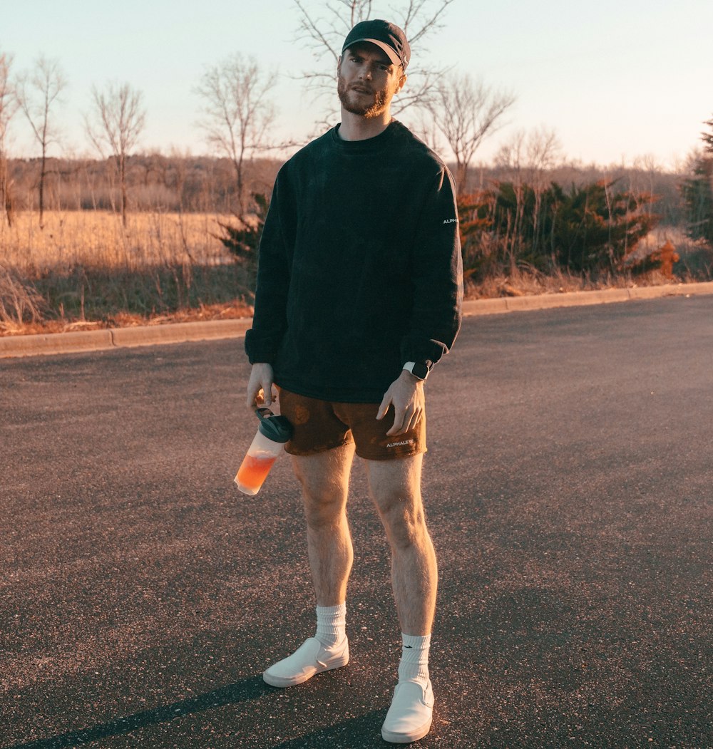 a man wearing a hat and shorts