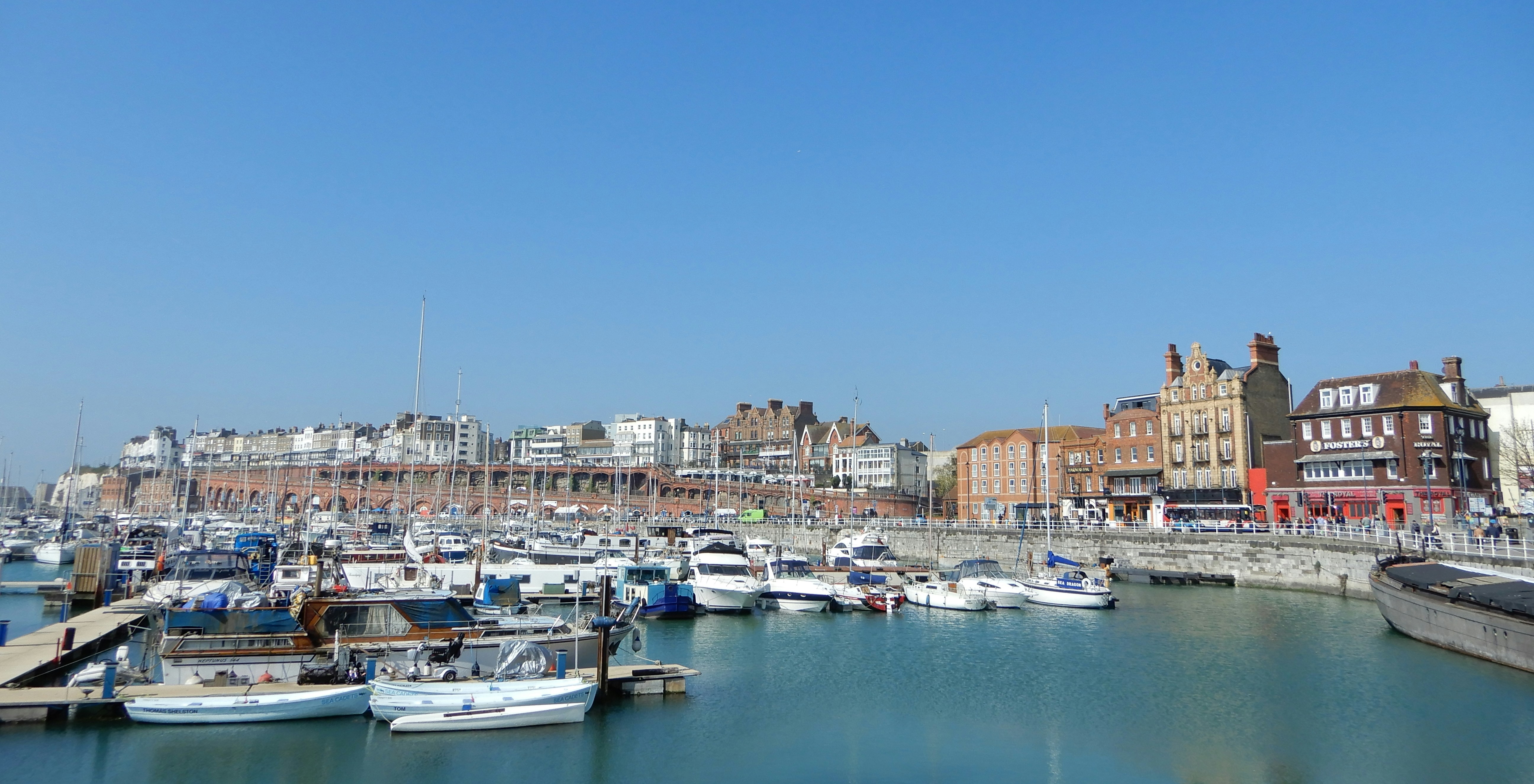 a body of water with boats in it and buildings in the back