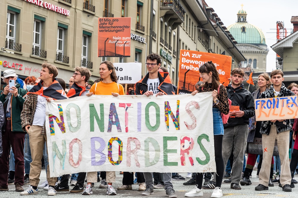 a group of people holding a banner