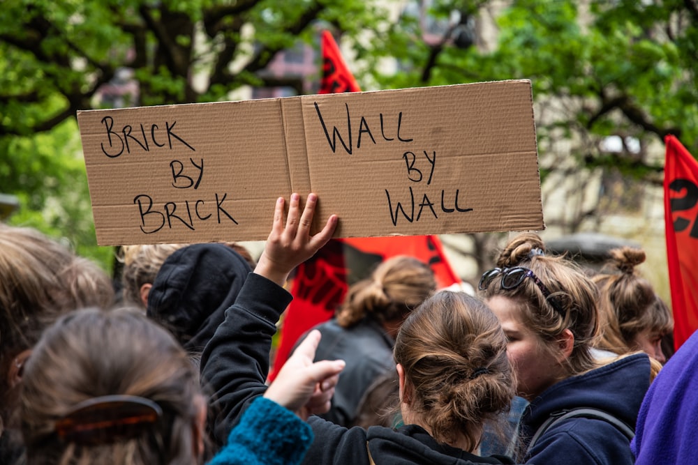 a group of people holding signs