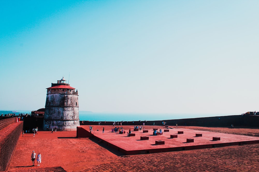 a large tower with a red roof