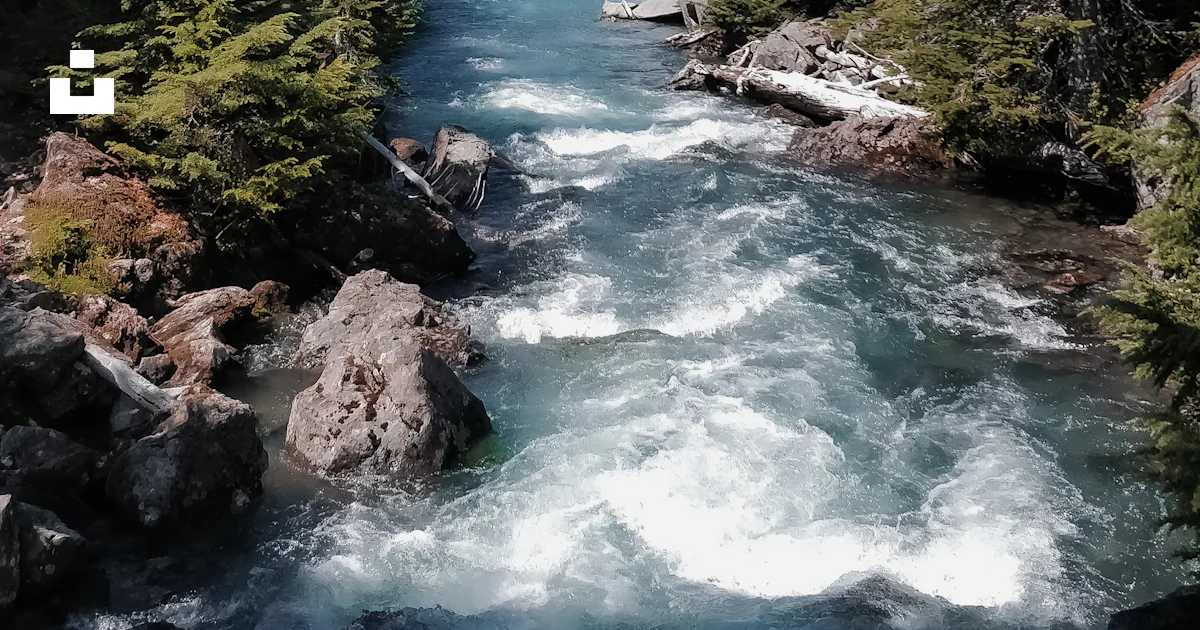 A river with rocks and trees photo – Free Panorama ridge Image on Unsplash