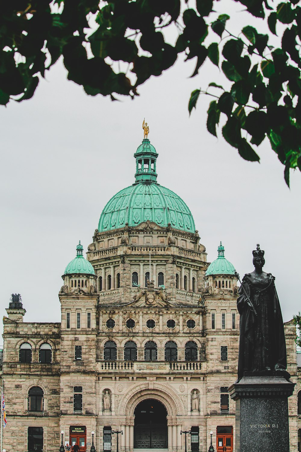 a large building with a green dome on top