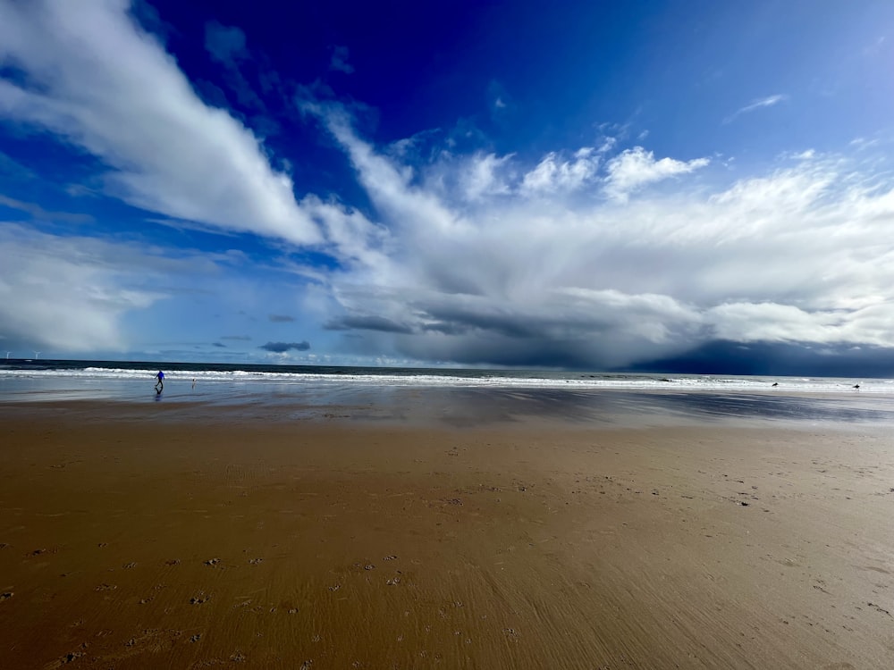 a person walking on a beach