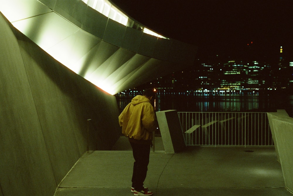 a person standing on a bridge