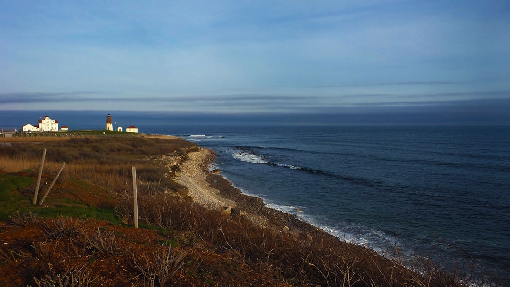 a beach with a lighthouse