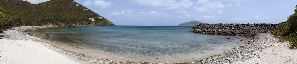 a beach with a body of water