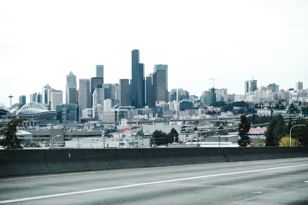 a city skyline with a road