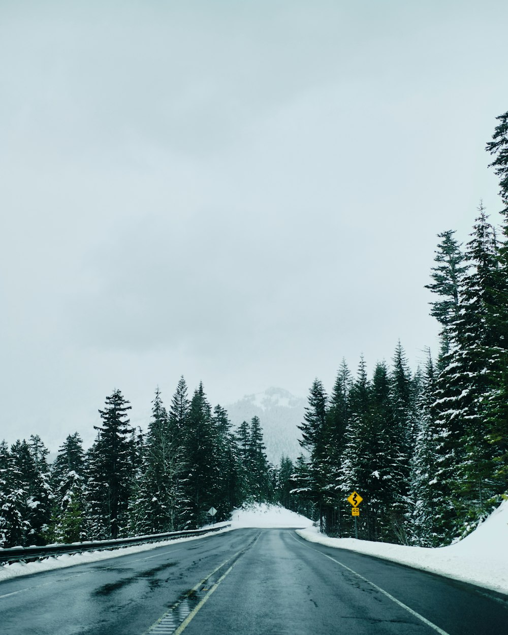 a road with snow on the side