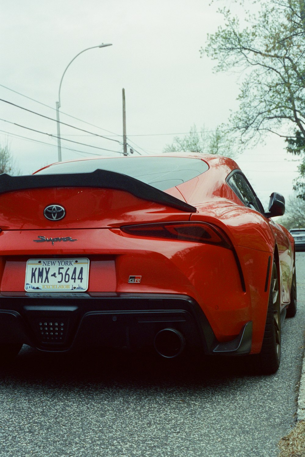 a red car parked on a street