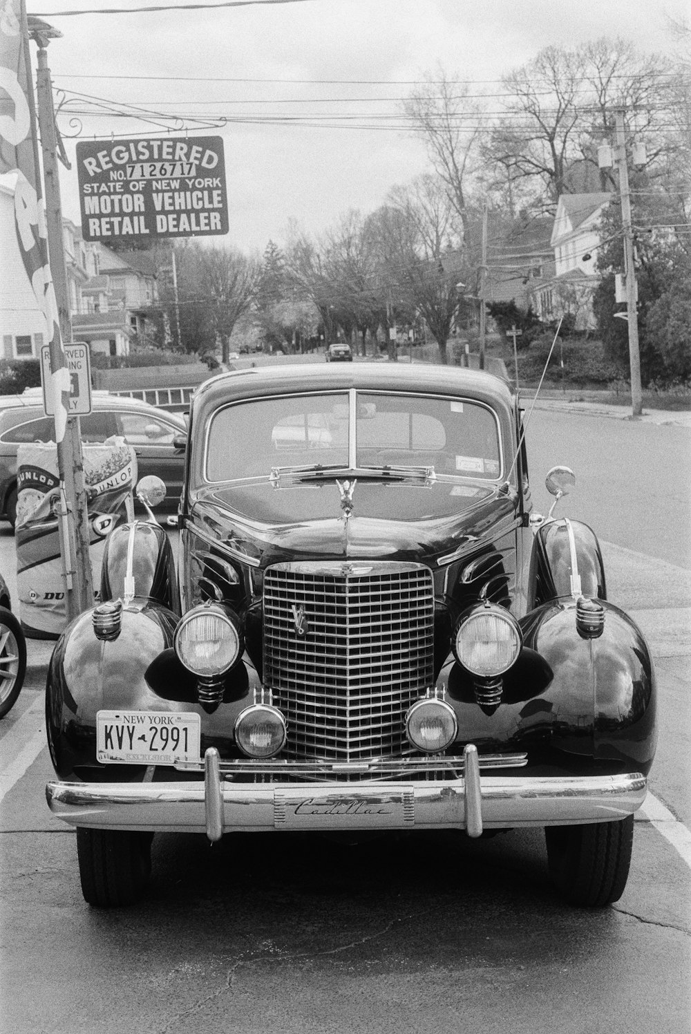 an old car parked on the side of the road