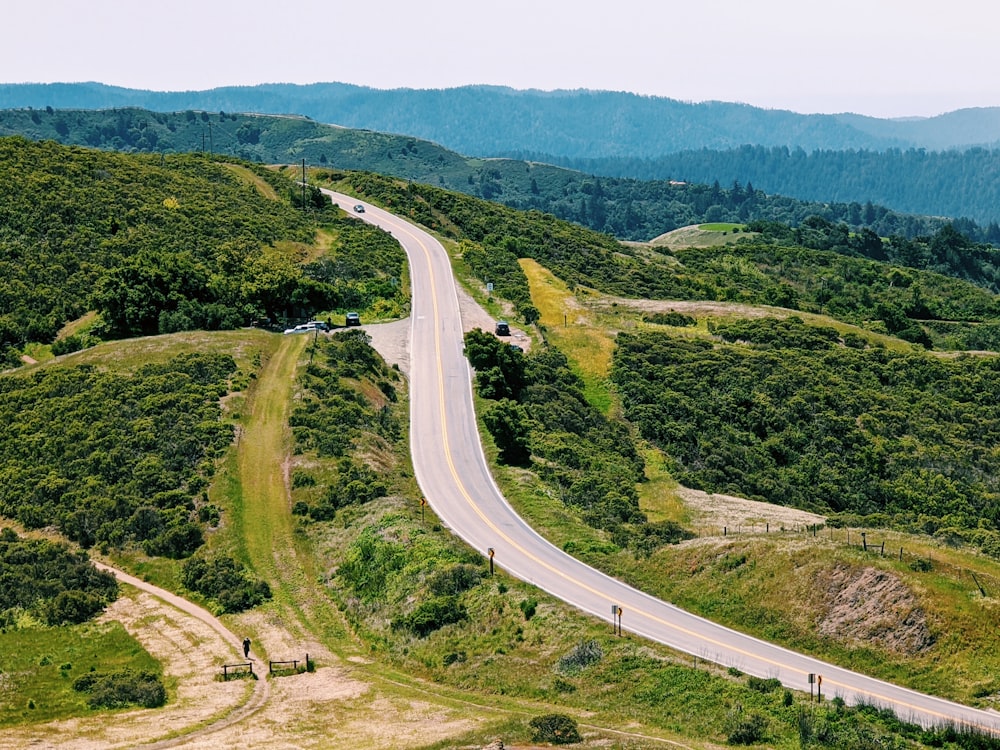 a winding road through a forest