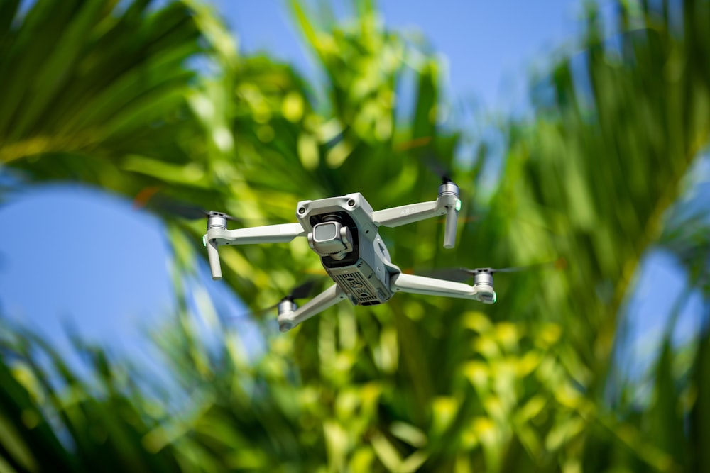 a drone flying over a field of grass