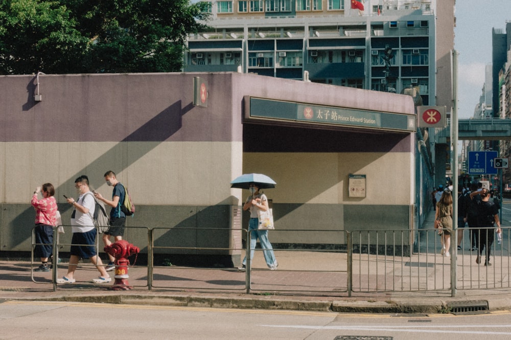 people walking on the sidewalk