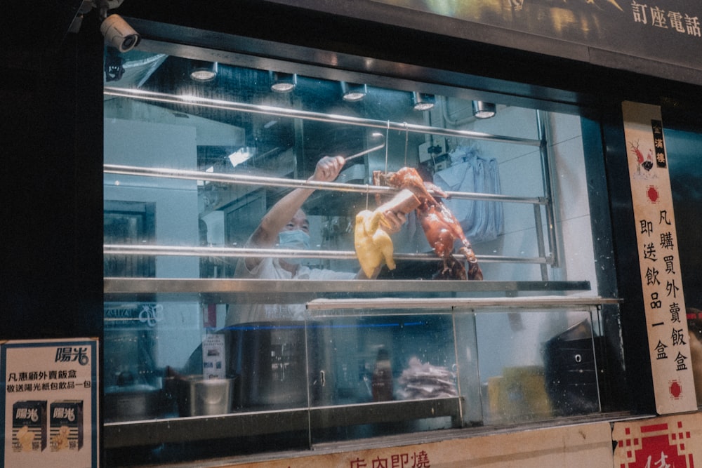 a person in a glass case