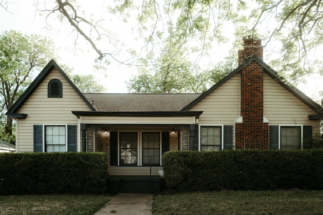 A single-story house with a brick chimney