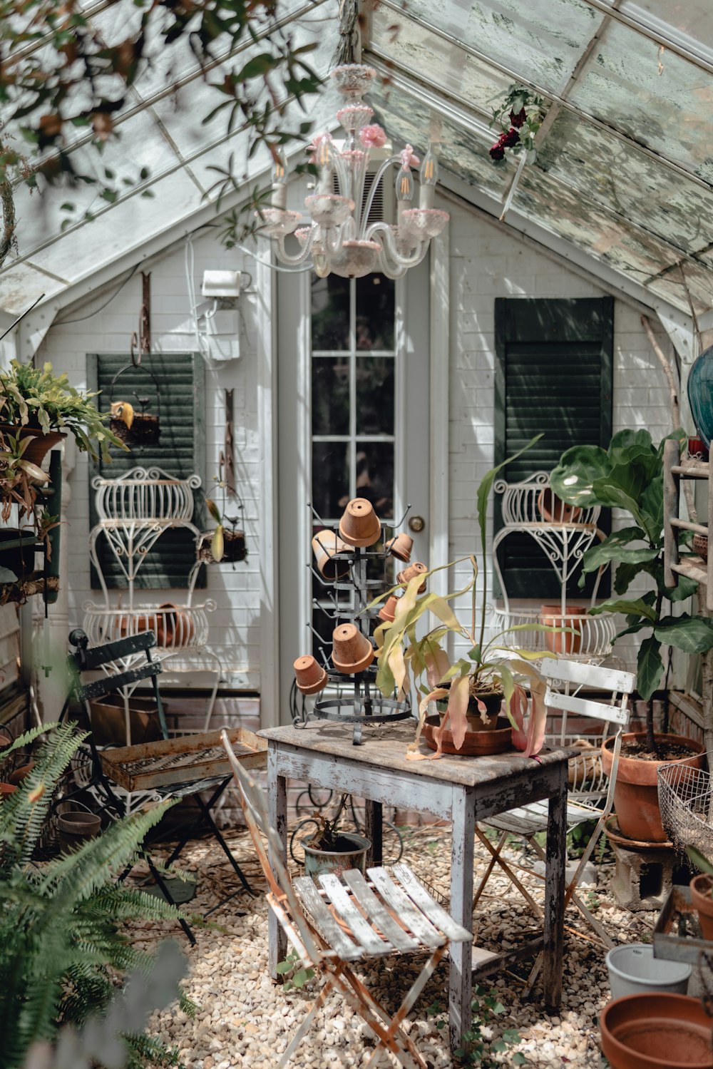 a small patio with a table and chairs