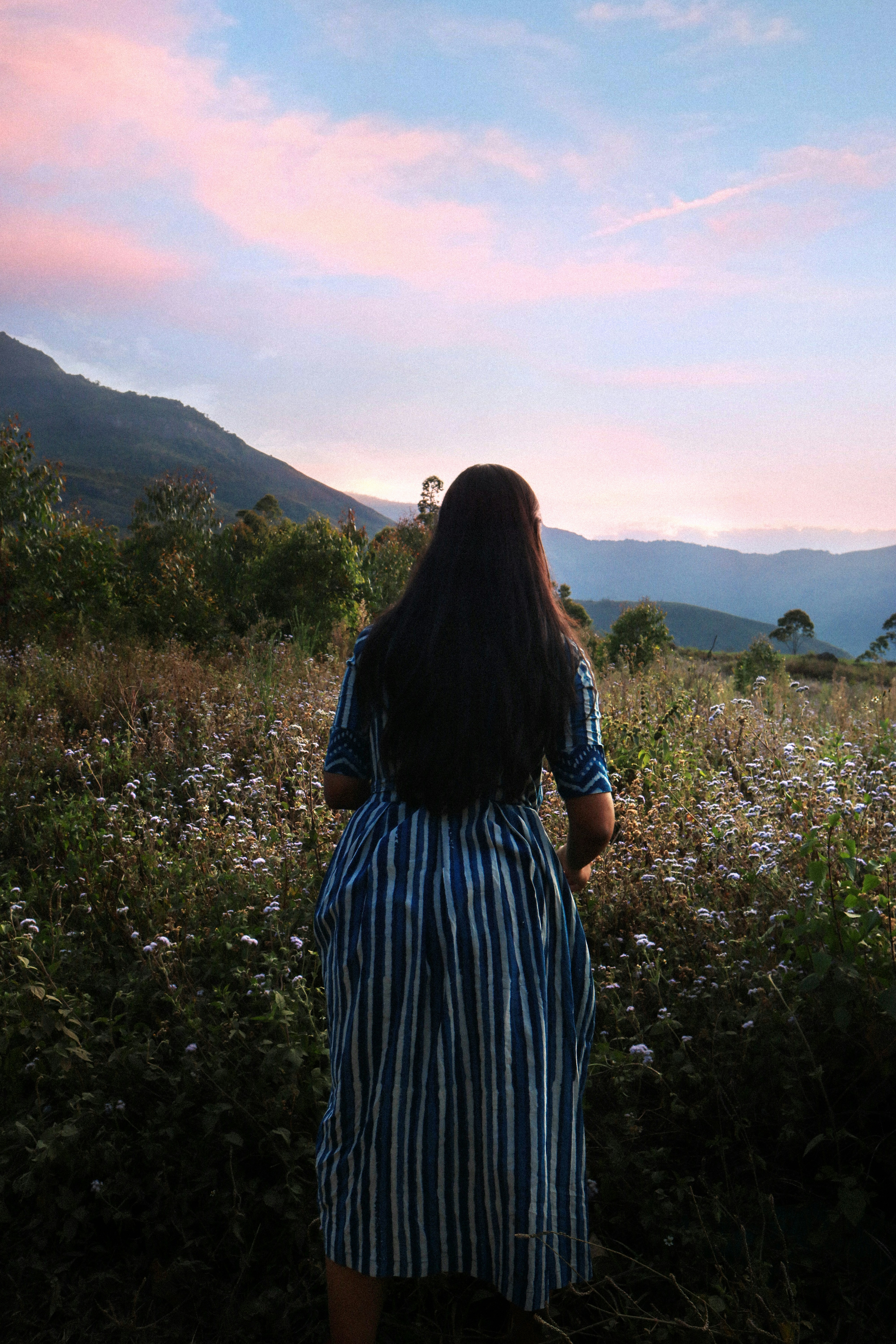 A person standing in a field of flowers photo – Free Girl Image on Unsplash